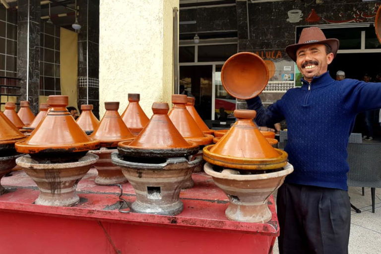 Moroccan man cooking traditional tagines Moroccan man cooking traditional tagines