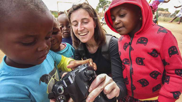 Traveller with men in traditional dress