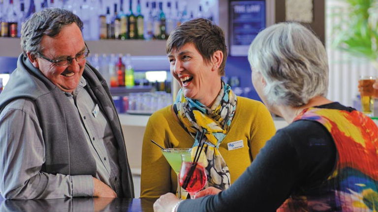 Travellers enjoying a bar in Auckland with Grand Pacific Tours