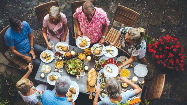 Group of diners around a table, courtesy of Insight Vacations
