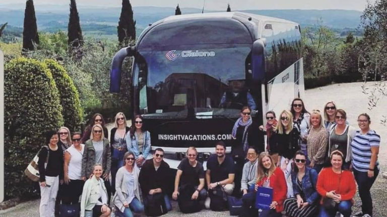 The Italy Intermezzo Tour Group in front of the Insight Vacations Coach