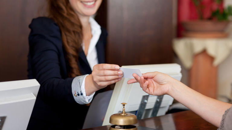 Hotel concierge assisting traveller